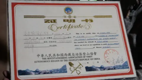 Family handout A certificate issued by China saying Morup successfully summitted Mt Everest on 10 May 1996