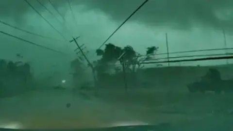 A power line is on the ground after a tornado.