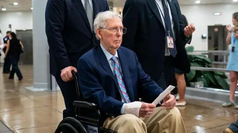 Getty Images Senator Mitch McConnell, a Republican from Kentucky, in the Senate Subway at the US Capitol in Washington, DC, US, on Tuesday, May 19, 2026. The Senate Budget Committee chairman said Republicans could use a future reconciliation bill to pass security funding for President Donald Trump's ballroom project if they can't tweak the current measure to pass procedural muster.

