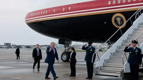 Reuters US President Donald Trump boards Air Force One in Cleveland, Ohio, on 11 August 2026