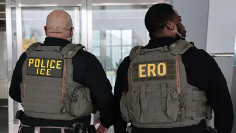 Getty Images Immigration and Customs Enforcement (ICE) agents patrol Terminal B at LaGuardia Airport on March 23, 2026 