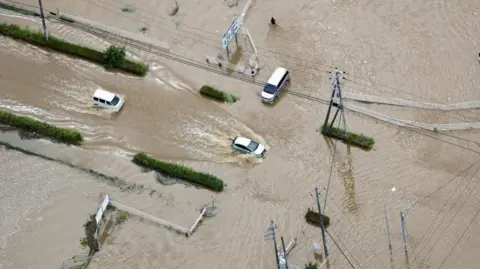 Reuters Cars were left abandoned in the streets of Oamishirasato, in Chiba