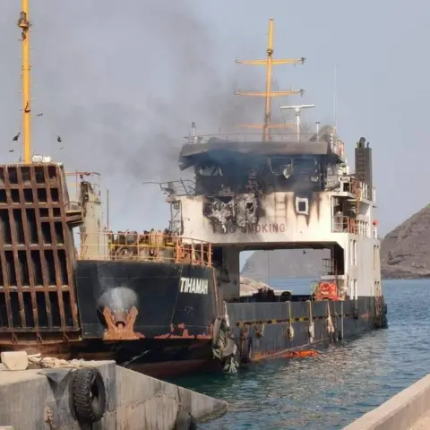 Reuters Smoke rising from vessel that appears to be moored