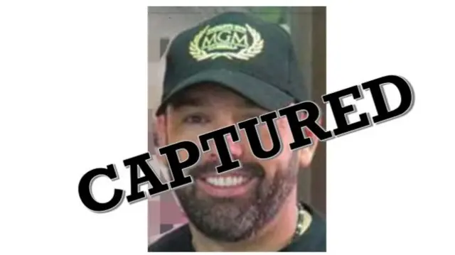 A copy of a wanted poster from the US State Department's website shows Daniel Kinahan's face with the word 'Captured' superimposed across it.