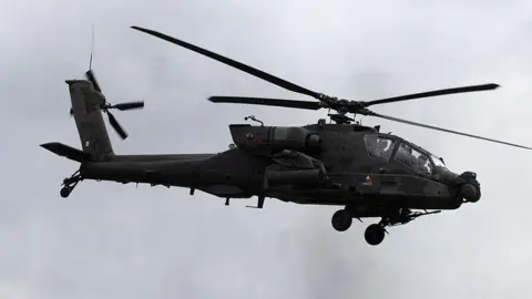 AFP via Getty Images image of military helicopter flying