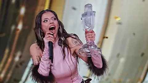 Getty Images Dara holds up her Eurovision trophy