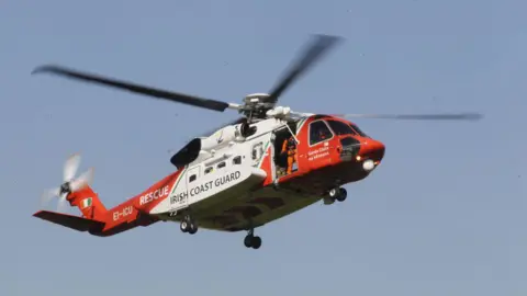 Getty Images An Irish Coast Guard helicopter in the sky 