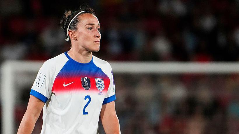 Lucy Bronze looking on in an England kit