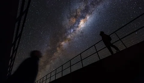 Eso/ Luis Calçada/ Herbert Zodet Two people look up at a starry night sky on the balconies at the Residencia in the Atacama Desert in Chile (Credit: Eso/ Luis Calçada/ Herbert Zodet)