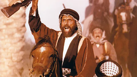 Iraqi Film Corporation A still of a man riding a horse and holding up a gun in Clash of Loyalties (Credit: Iraqi Film Corporation)