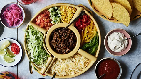 Taco!/ Lars Petter Pettersen Aerial view of taco shells and toppings laid out on a table for a family meal (Credit: Taco!/ Lars Petter Pettersen)
