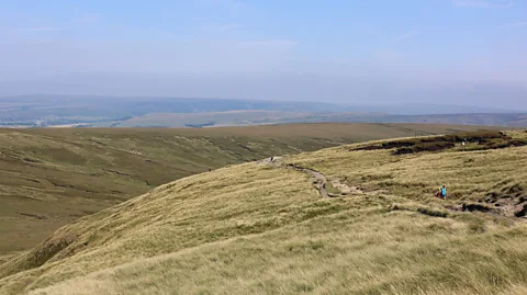BBC/ Amy Wright Views of wild moorland as you ascend Kinder Scout stretch for miles. On a clear day you can see the Manchester skyline in the distance (Credit: BBC/ Amy Wright)