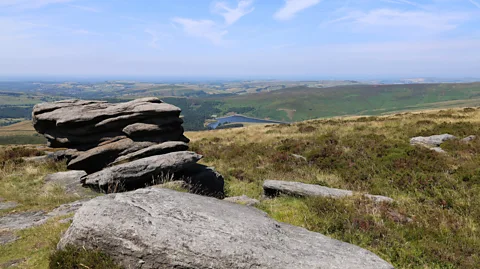 BBC/ Amy Wright Massive gritstones can be seen all across the plateau of Kinder Scout – they are hundreds of millions of years old (Credit: BBC/ Amy Wright)